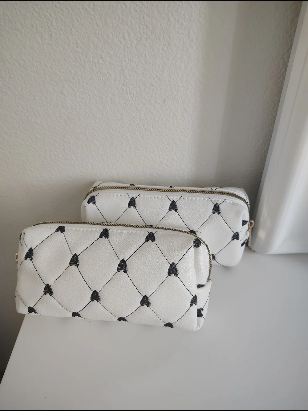 Under One Sky White Faux-Leather Cosmetic Pouch Duo with Black Heart Stitching